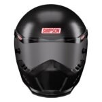 Carbon fiber motorcycle helmet with tinted visor and distinctive Simpson branding, front view.