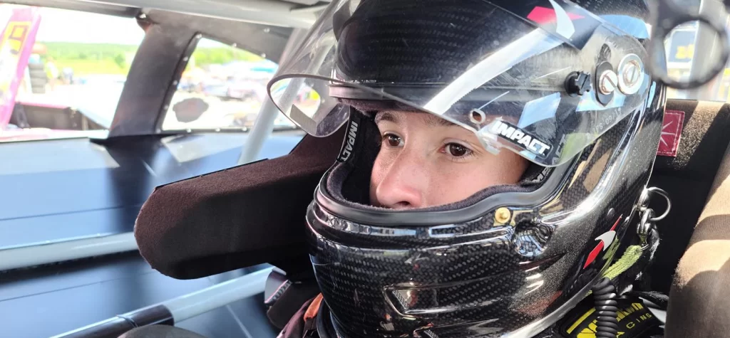 race car driver in car full containment halo racing seat 1